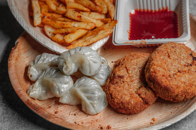6pcs Momos  2pcs Chicken Cutlets  French Fries